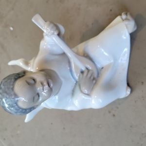 Lladro vintage angel-black-playing lute. No cracks or chips.